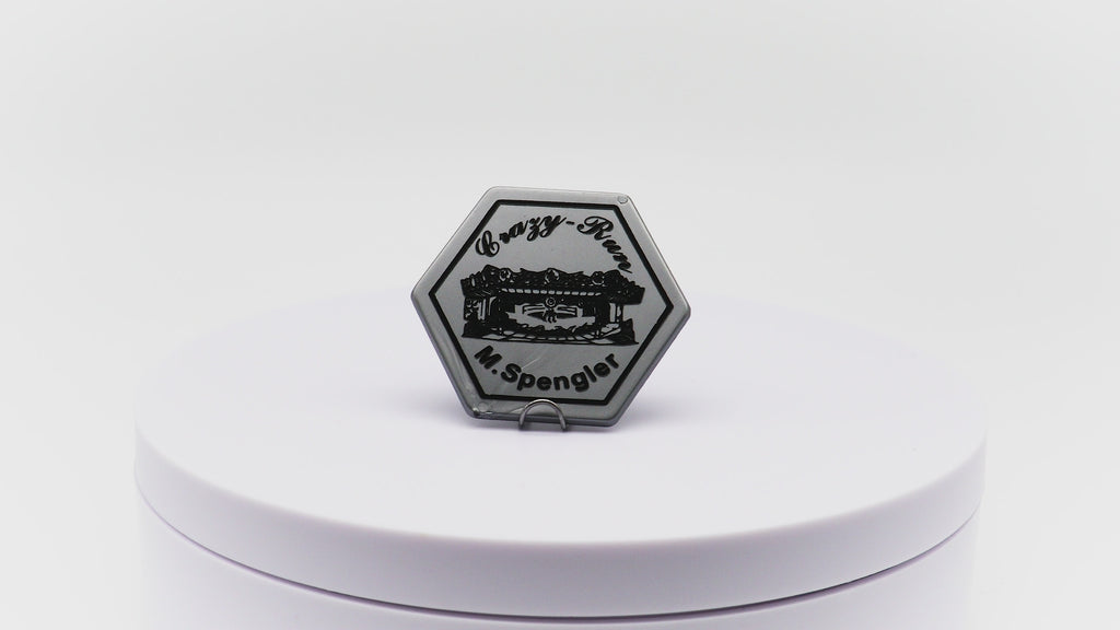Video of hexagon shaped token with custom printing in black