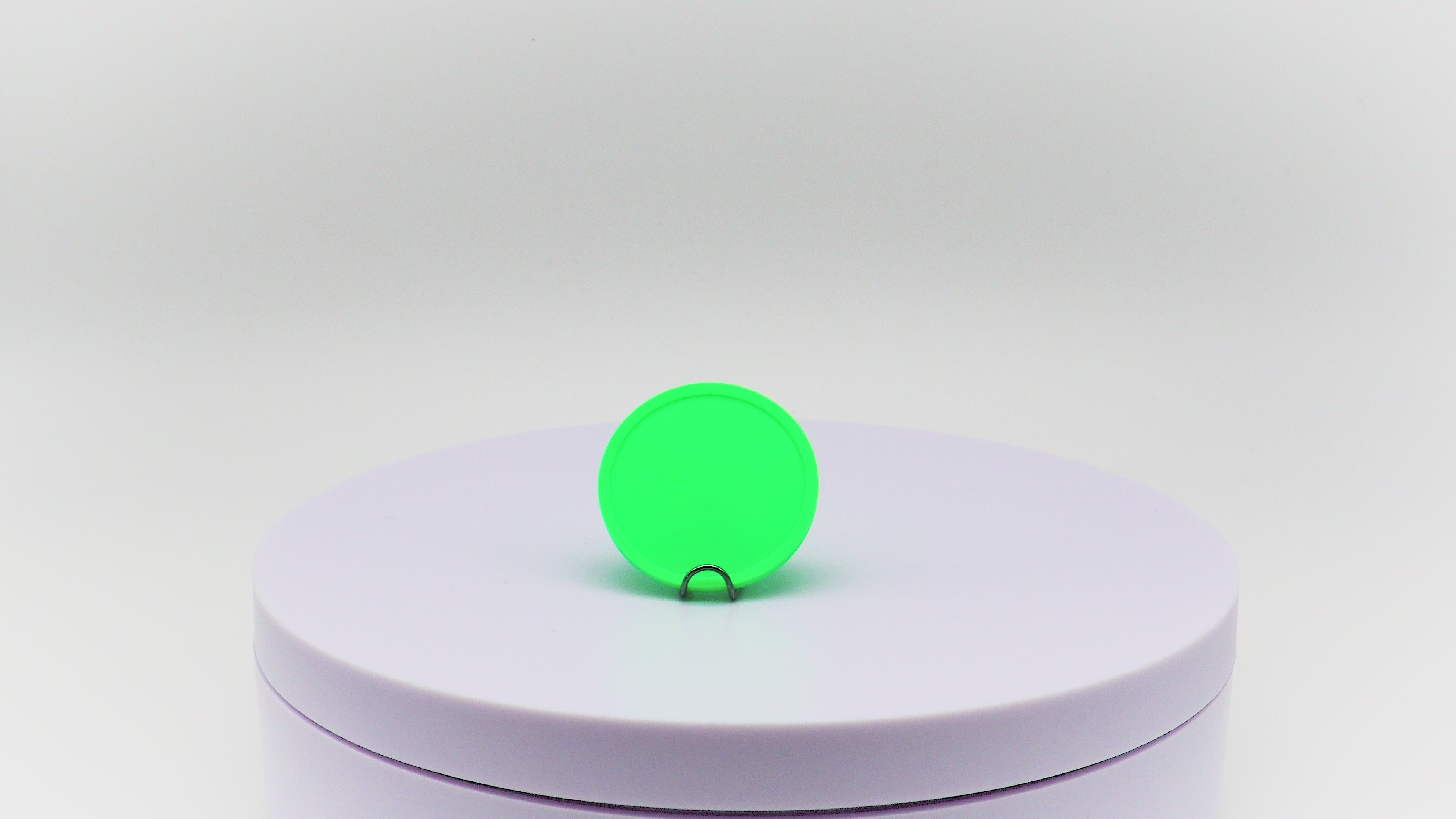 Video of neon green reward token rotating