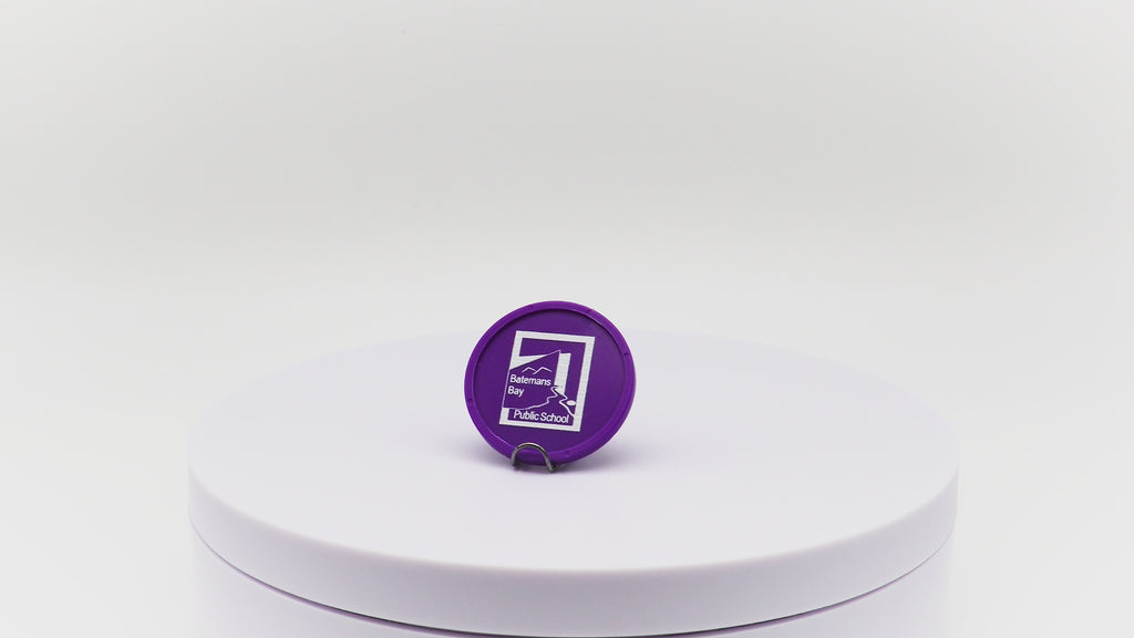 Video of purple token with custom white printing