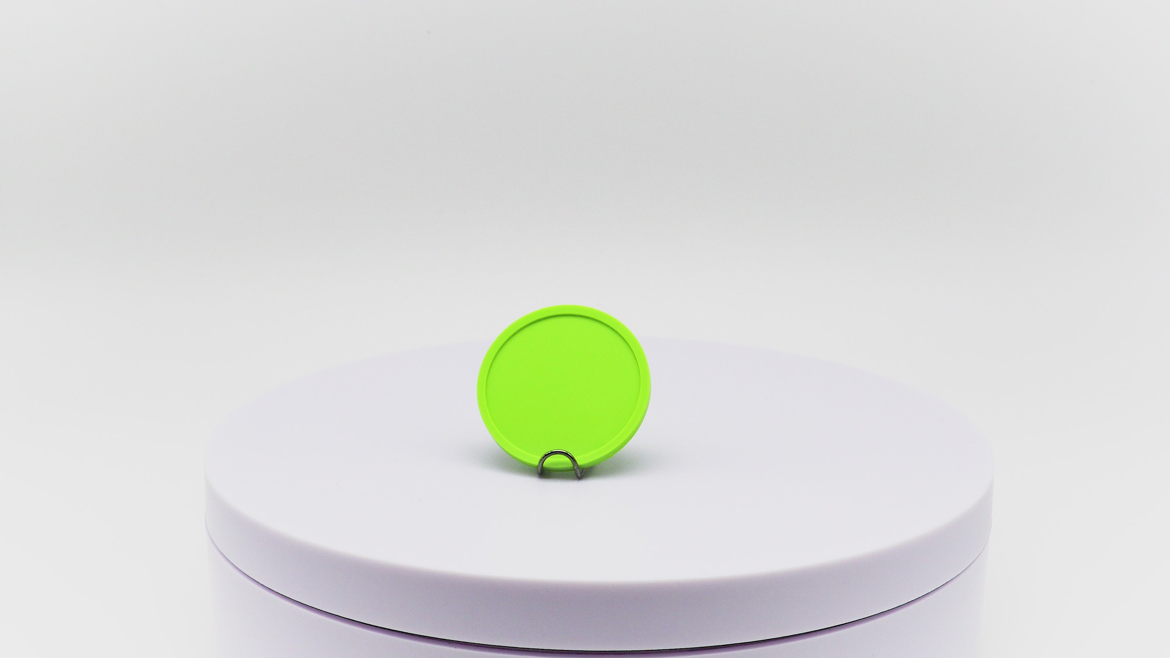 Video of lime green reward token rotating