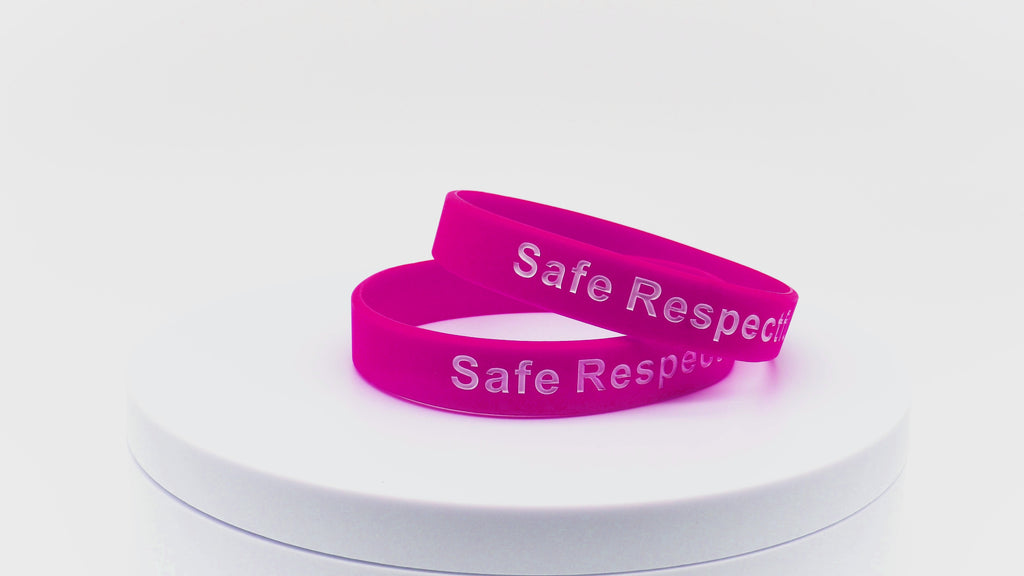 Video of dark pink wristbands with white printing