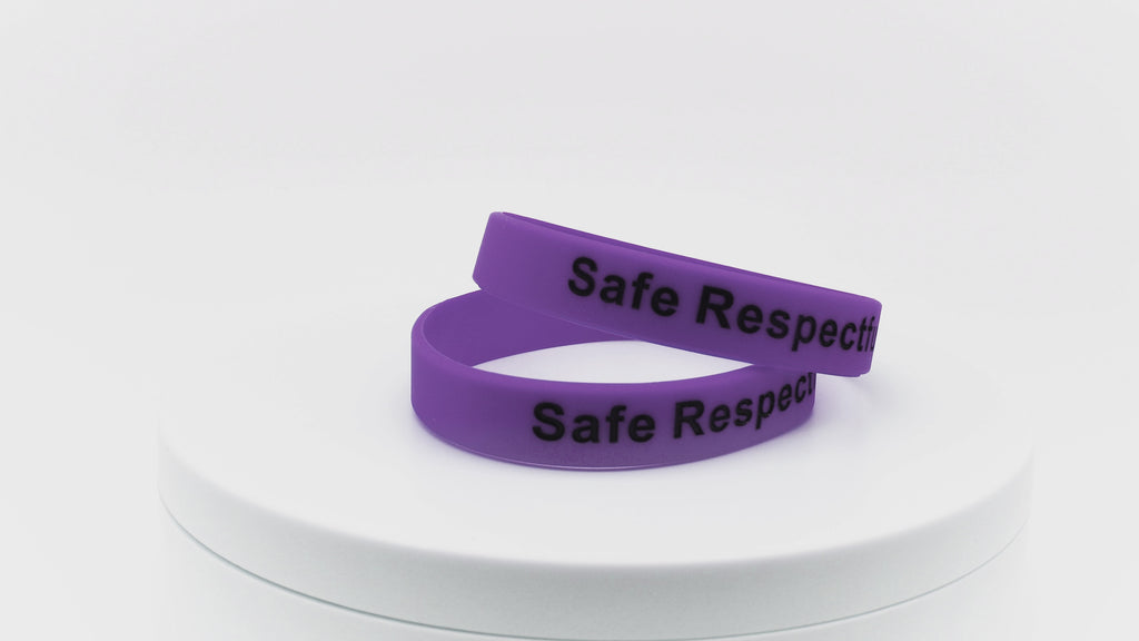 video of purple silicone wristbands with black printing
