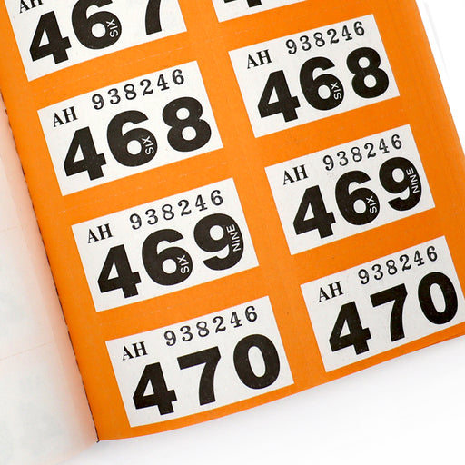 Close Up Of Orange Raffle Ticket Book