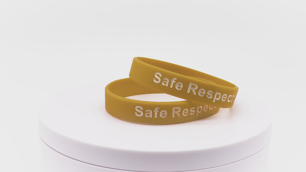 Video of gold silicone wristbands with white printing