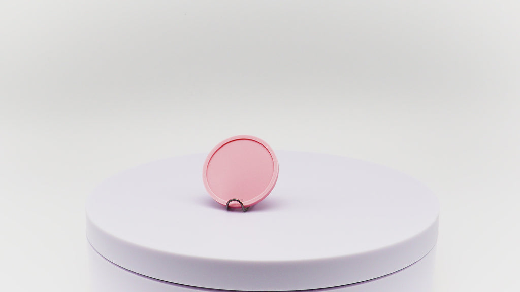 Video of light pink event token rotating