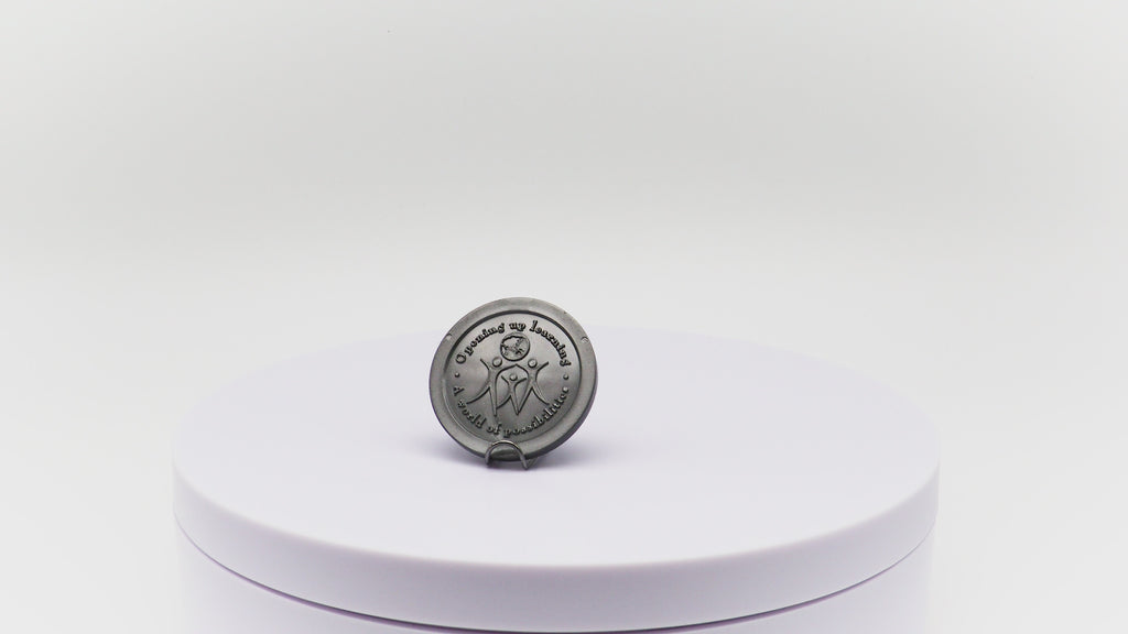 Video of silver token with custom embossing