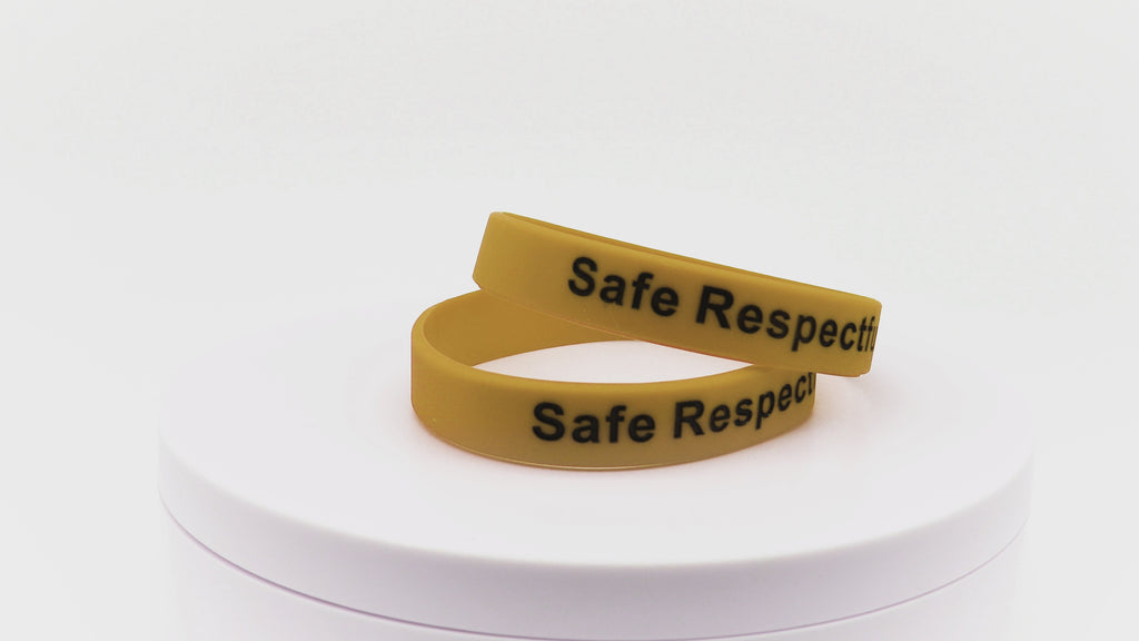 Video of gold silicone wristbands with black printing