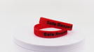 Video of red silicone wristbands with black printing